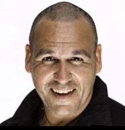 A head shot photo of Justin looking strait at the camera