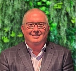 A head shot photo of Professor Tim Geraghty looking strait at the camera